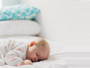 baby sleeping protected by safety hinge